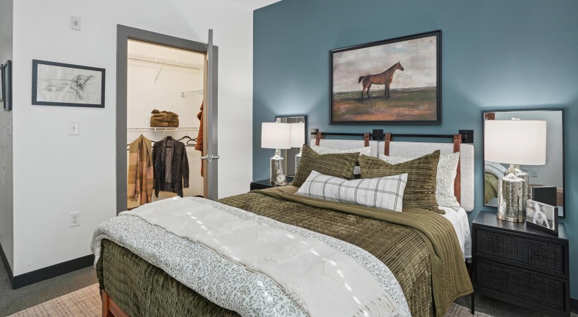 a bedroom with a large mirror