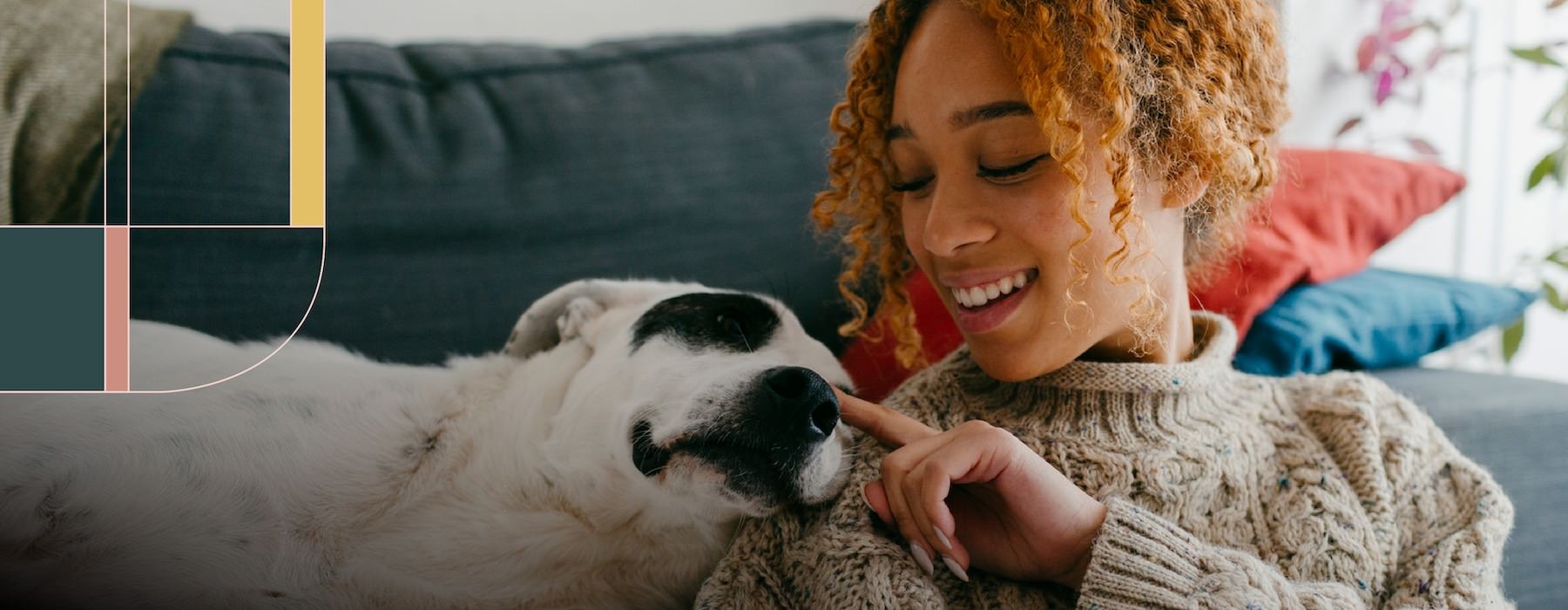 a woman petting a dog