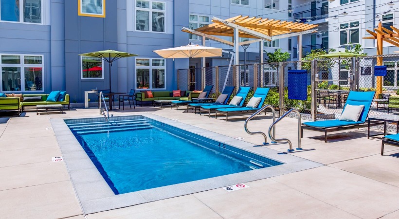 a pool with chairs around it